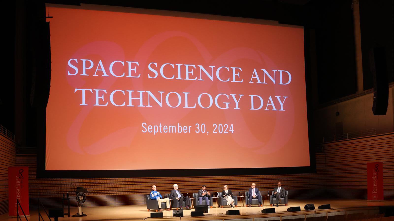 Screen shot of the screen behind the panelists at the Science and Technology Day at RPI