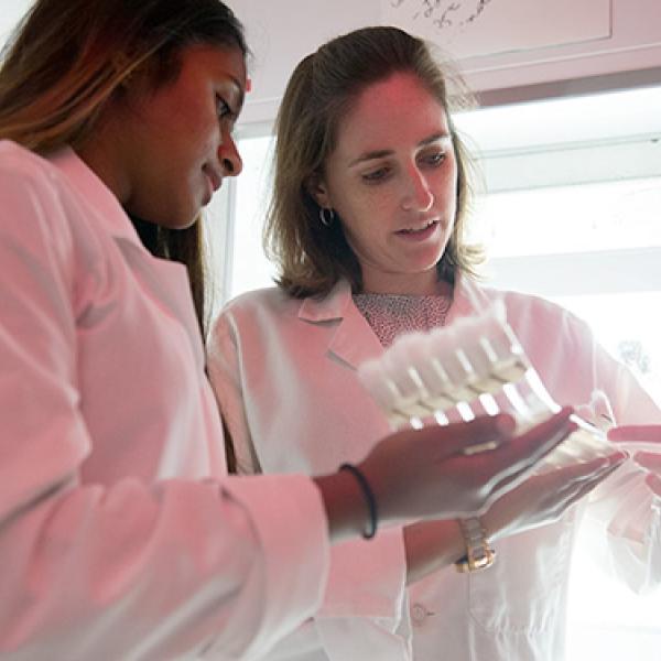 Professor works with a student in the lab